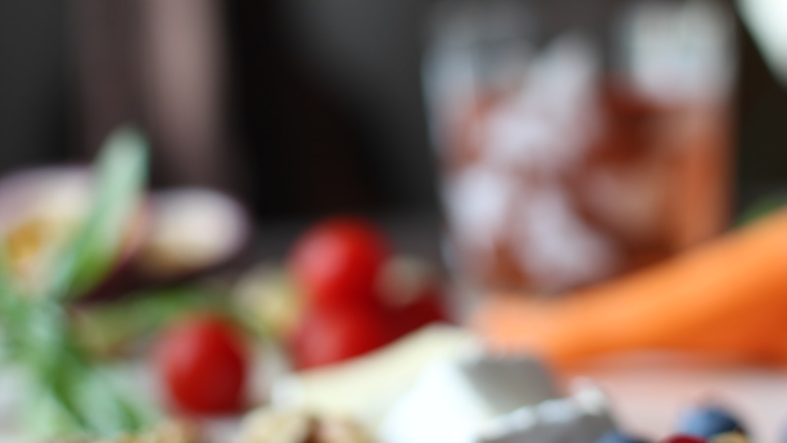 Bowl of fresh red cherries on white ceramic — five foods for skin
